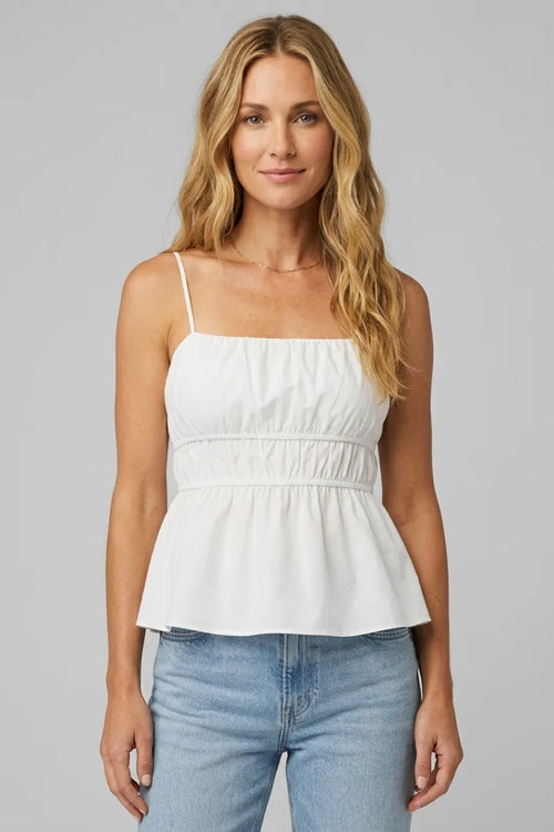 White cotton sleeveless peplum adele back tie top with thin straps and gathered waist for women’s boho chic clothing