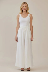 White sleeveless tank top with drawstring waist wide leg pants