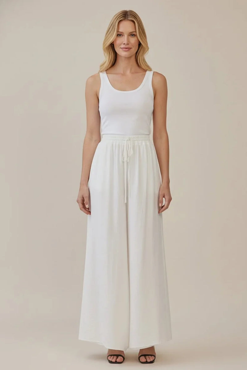 White sleeveless tank top with drawstring waist wide leg pants