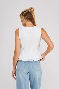 White sleeveless square neck zig zag blouse with textured knit pattern and delicate lace trim along the hem