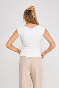White sleeveless boat neck scrunch tank top with v-neckline and gathered waistband in lightweight fabric