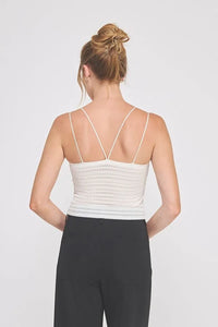 Cream ribbed knit bralette cami with zig zag patterned texture and thin crisscross straps in white color