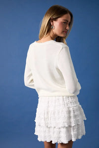 White textured knit round neck flag print sweater top with tiered ruffle skirt detailing in soft fabric