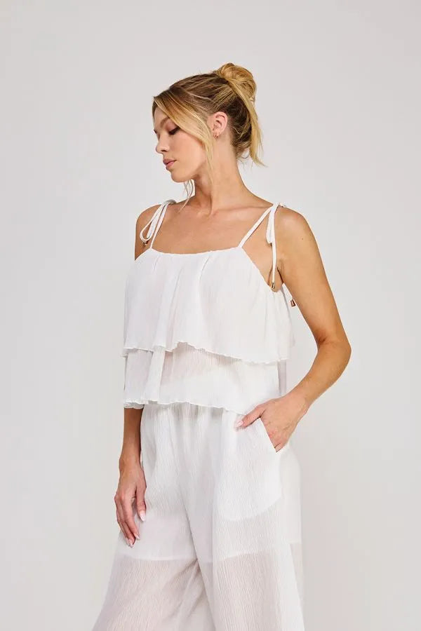 White textured woven tie strap ruffle layer top with thin adjustable straps and sheer fabric details in camisole style