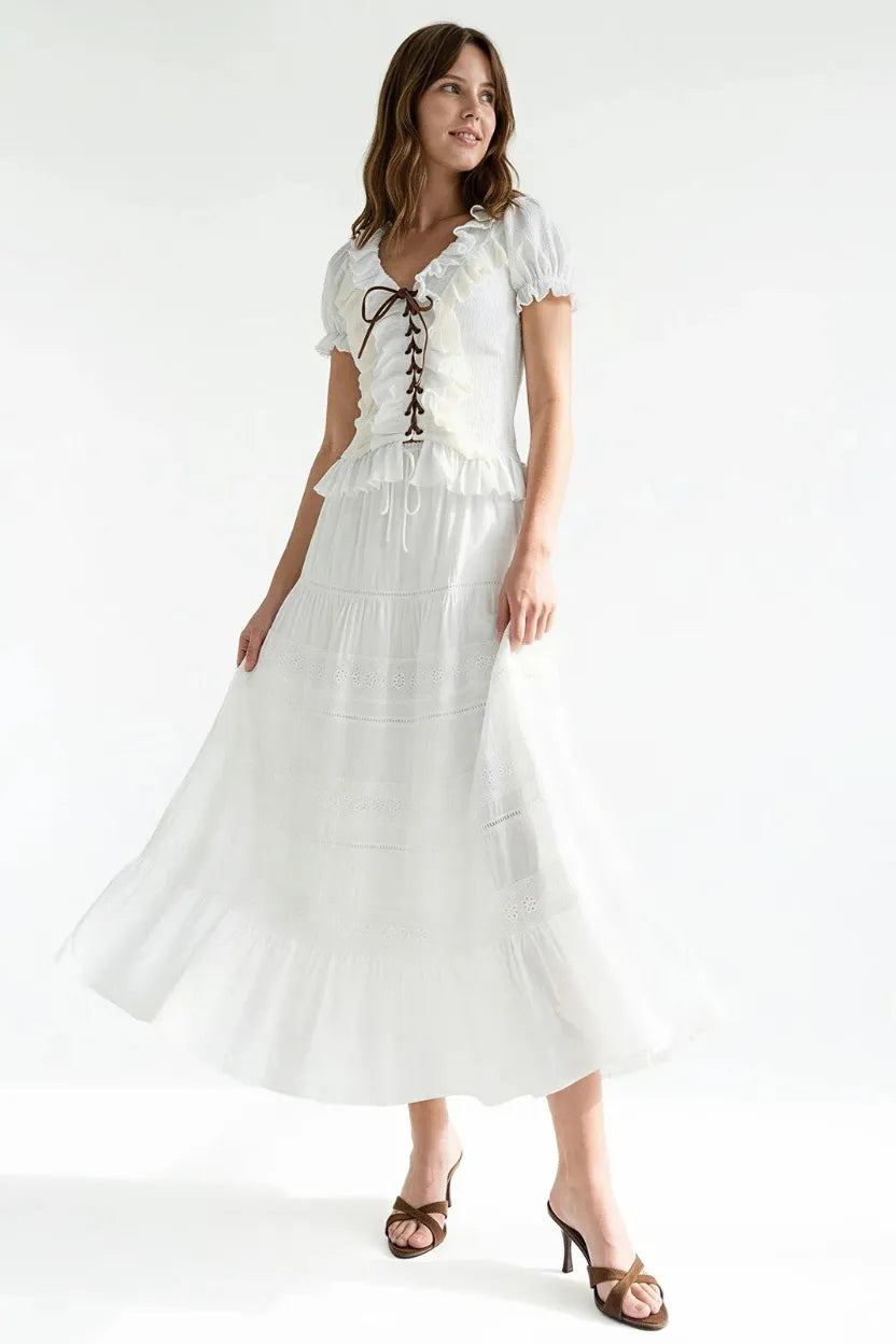 White tiered maxi skirt dress with ruffled sleeves and lace-up corset front in boho breeze tiered maxi style