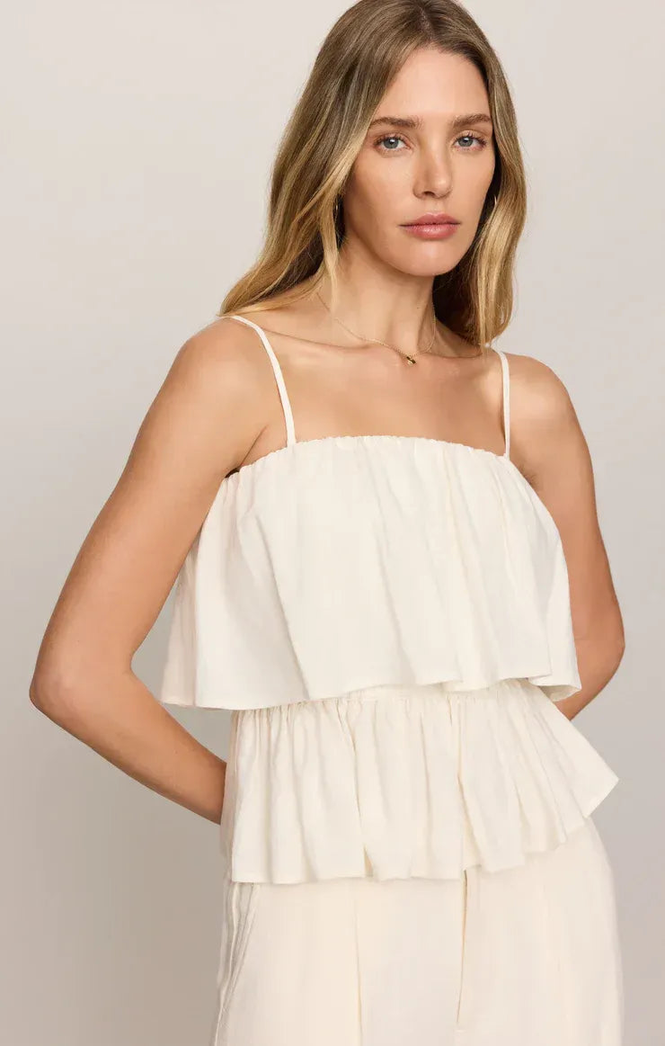 White strapless linen mabel top with tiered ruffles and thin spaghetti straps in lightweight breathable fabric