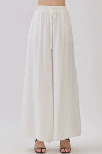 White drawstring waist wide leg pants, back view