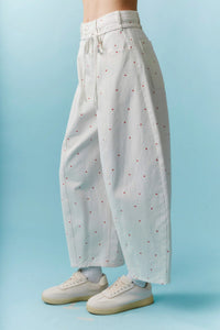 High waist white wide-leg pants with mini bow print red dots and drawstring waistband for casual wear