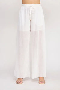 White wide-leg pants with elastic tie waist featuring textured woven sheer pleated fabric for elegant wear