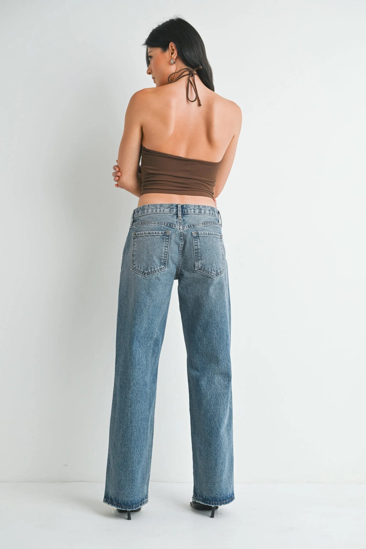 Wide-leg medium-wash blue denim jeans with classic stitching and back pockets low rise baggy slouchy denim style