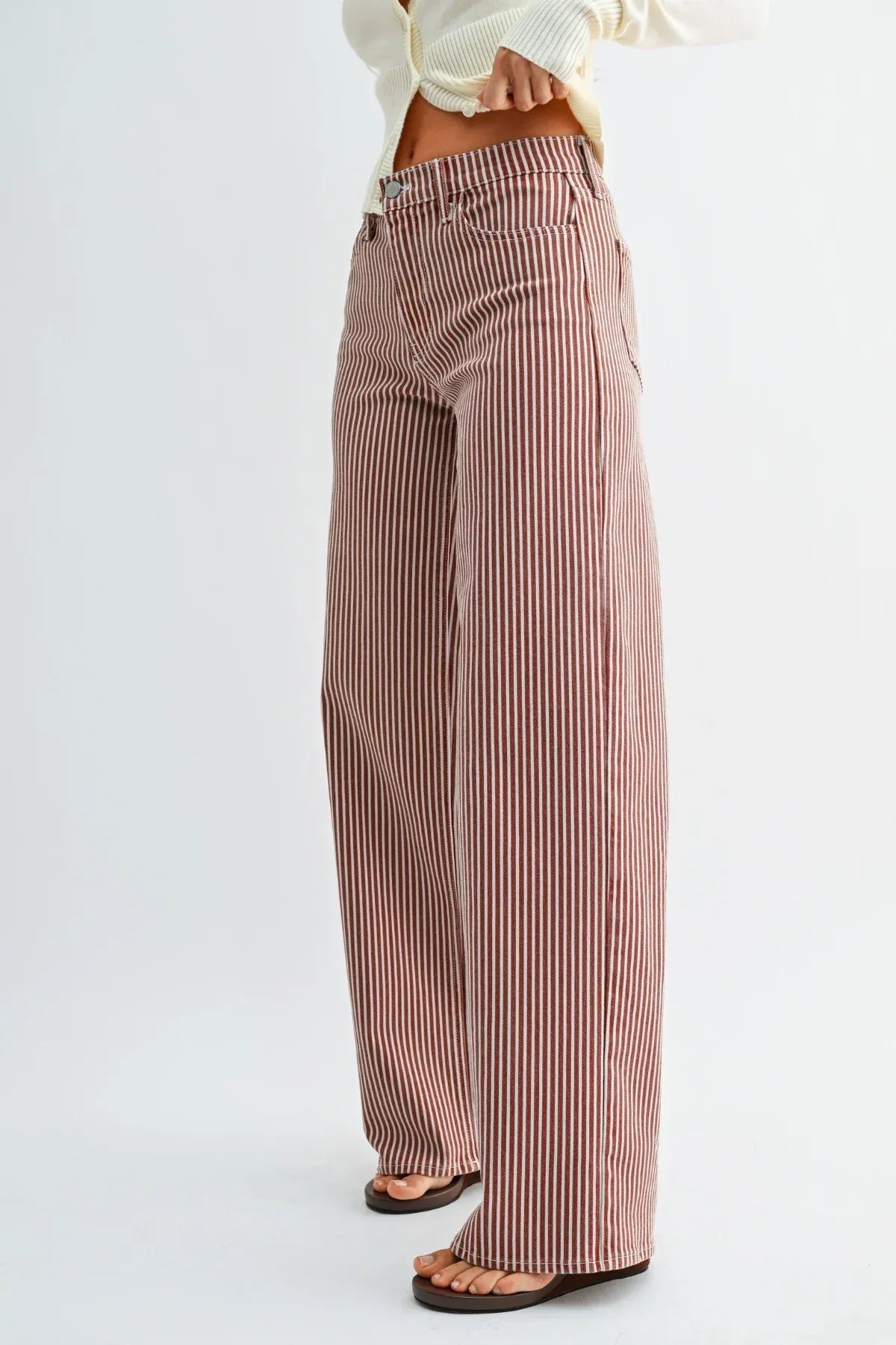 High rise relaxed wide leg denim jeans in muted rose and white vertical stripes crafted from soft denim fabric