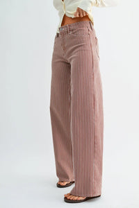 High rise relaxed wide leg denim jeans in muted rose and white vertical stripes crafted from soft denim fabric