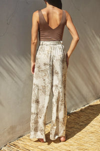 Printed belted wide leg pants in cream and muted brown with vintage landscape print made from lightweight fabric