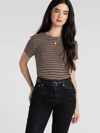 A woman wearing a slim fitting thread and supply annie tee in brown and black striped basic t shirt top