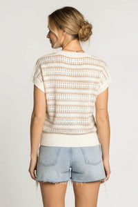 Woman in knit striped short sleeve top with cream beige white lace stripes