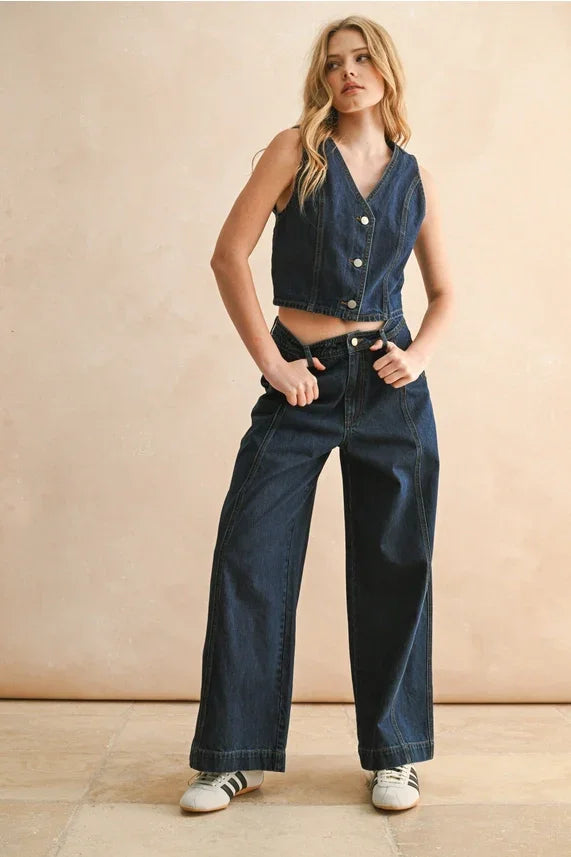 Woman in button down denim vest and wide-leg jeans, shop daisy boho chic