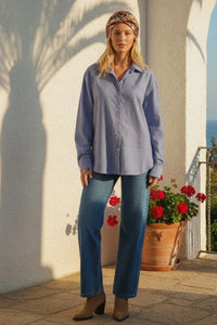 Woman in Seaport Striped Button down shirt, light blue white stripes