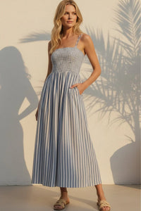Nadine striped maxi dress: woman in long sleeveless blue white vertical stripes