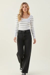 Woman in classic ribbed scoop neck long sleeve striped top