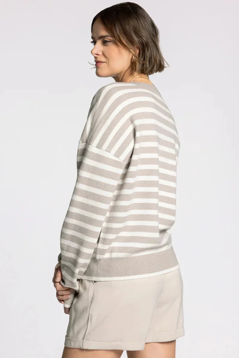 Woman in Thread & Supply Preston Sweater with gray white stripes