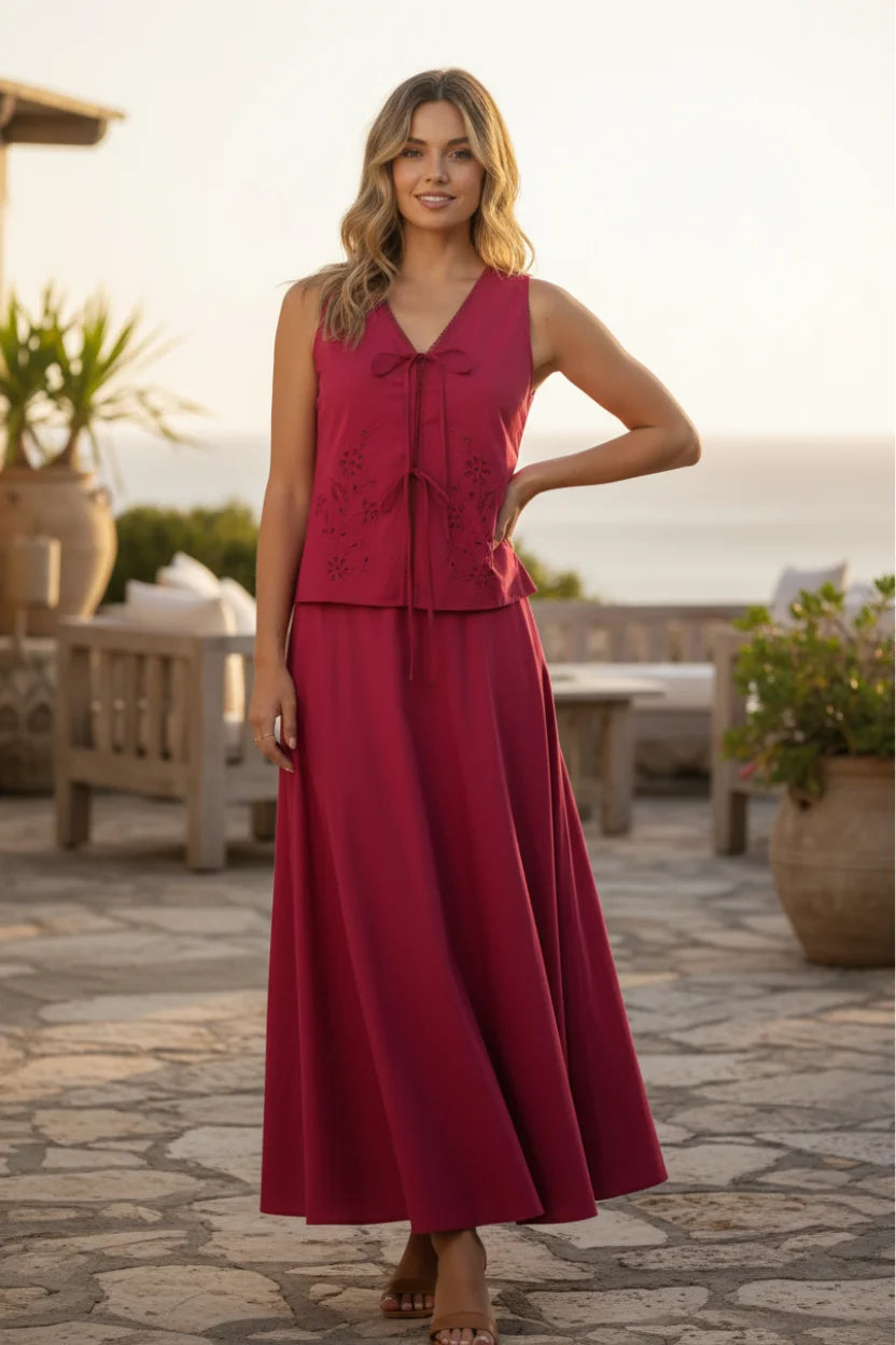 Woman in Lost + Wander Vino Kiss Vest Top red dress with embroidered bodice