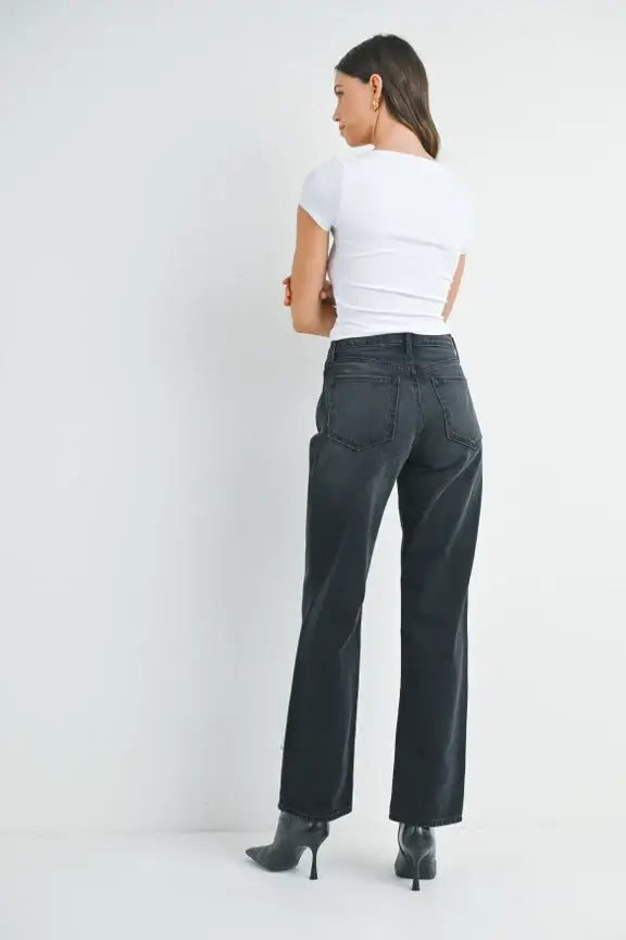 Woman wearing high-waisted relaxed fit denim straight leg jeans for a casual look