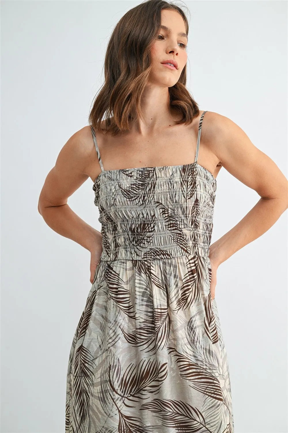 Women’s sleeveless midi dress with leaf print smocking in shades of brown on light gray fabric