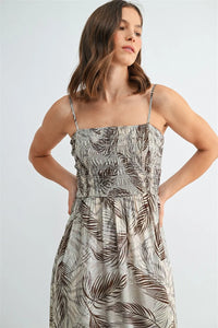 Women’s sleeveless midi dress with leaf print smocking in shades of brown on light gray fabric