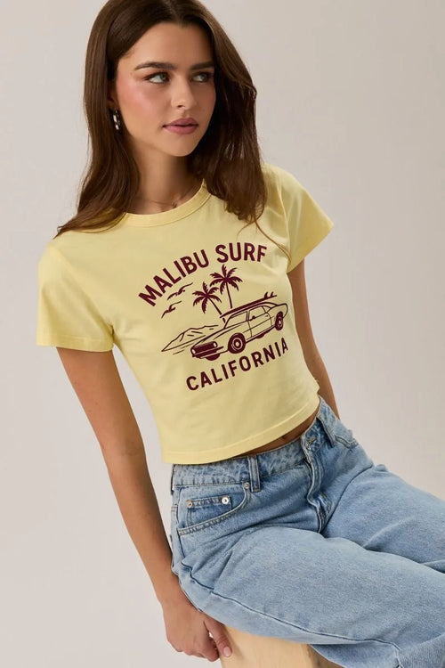 Yellow cropped baby tee featuring maroon malibu surf graphic with surfboard car and palm trees for casual wear