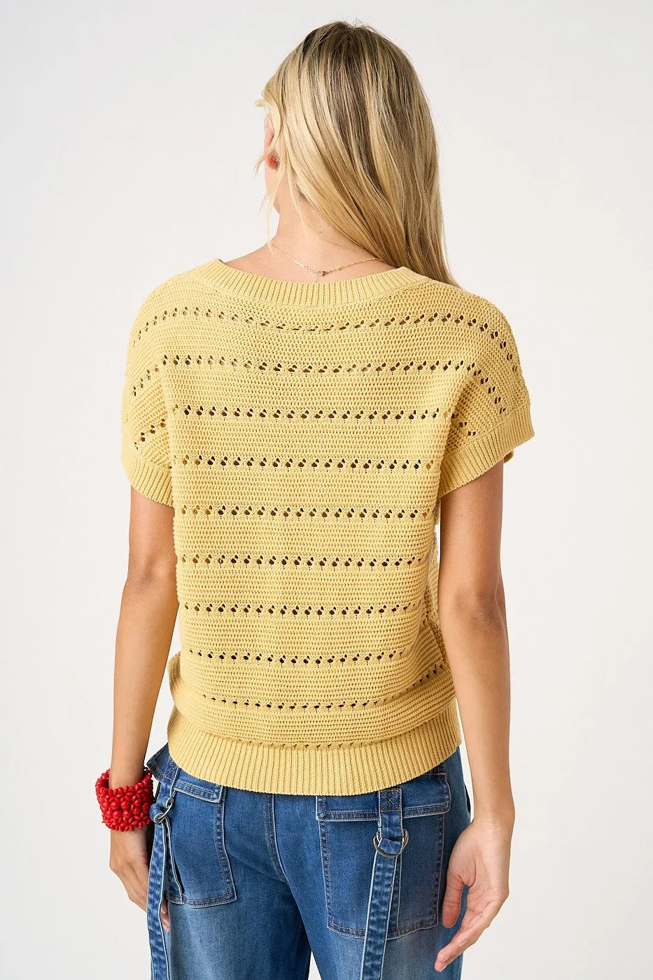 Yellow knitted short-sleeved top with textured pattern and american flag patch ribbed hem design