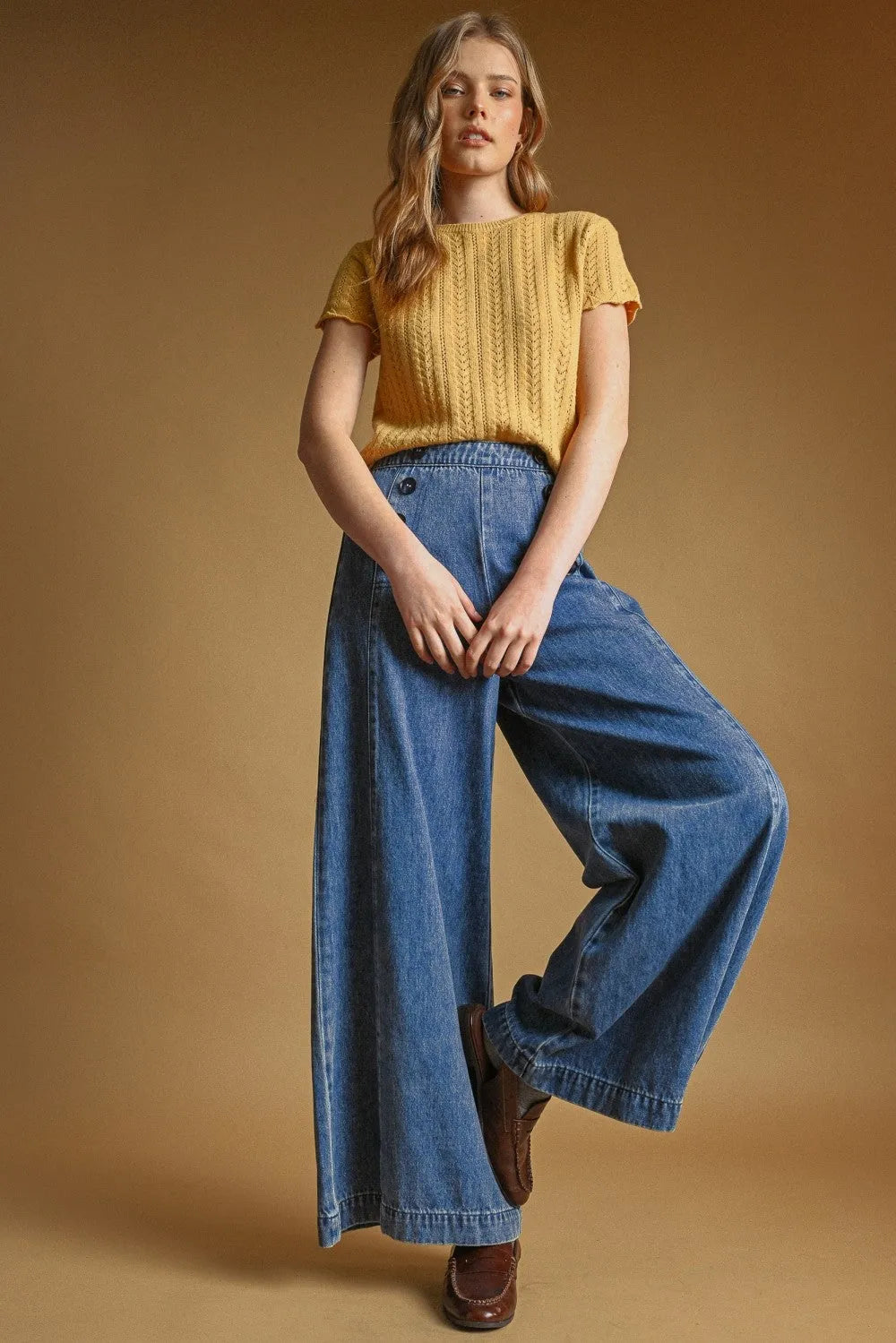 Yellow short sleeve knitted top with a pointelle short sleeve design and textured pattern in soft knit fabric