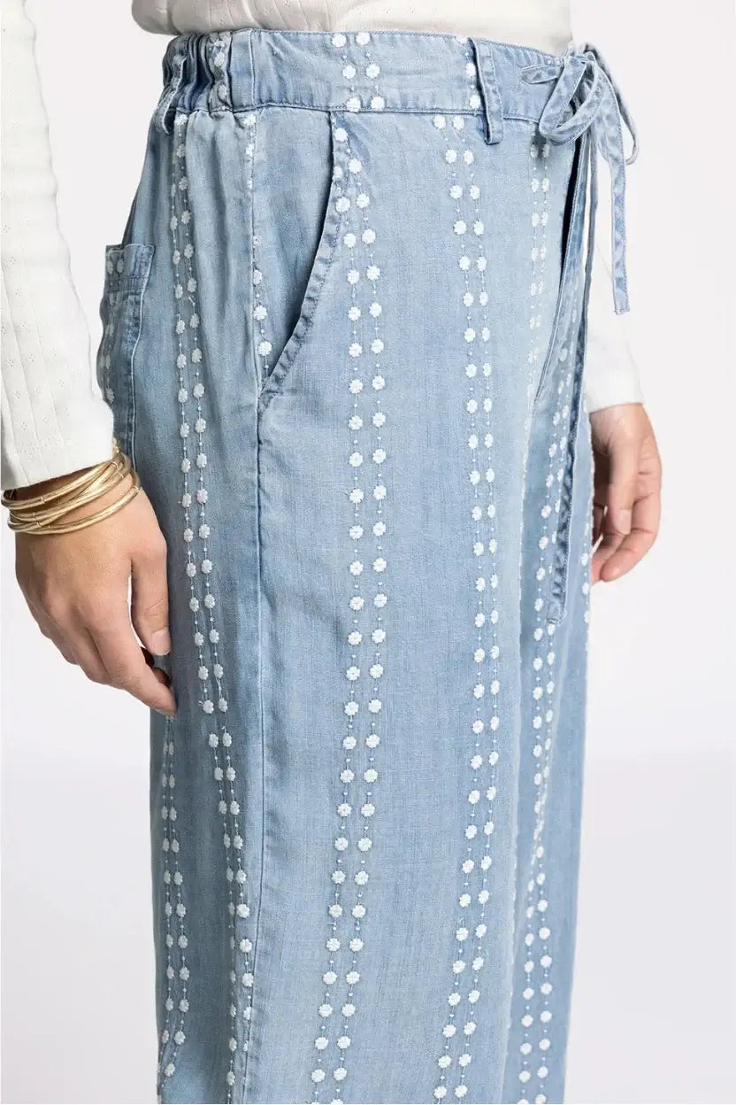 Thread & Supply Natalia pants in light blue denim with white floral embroidery