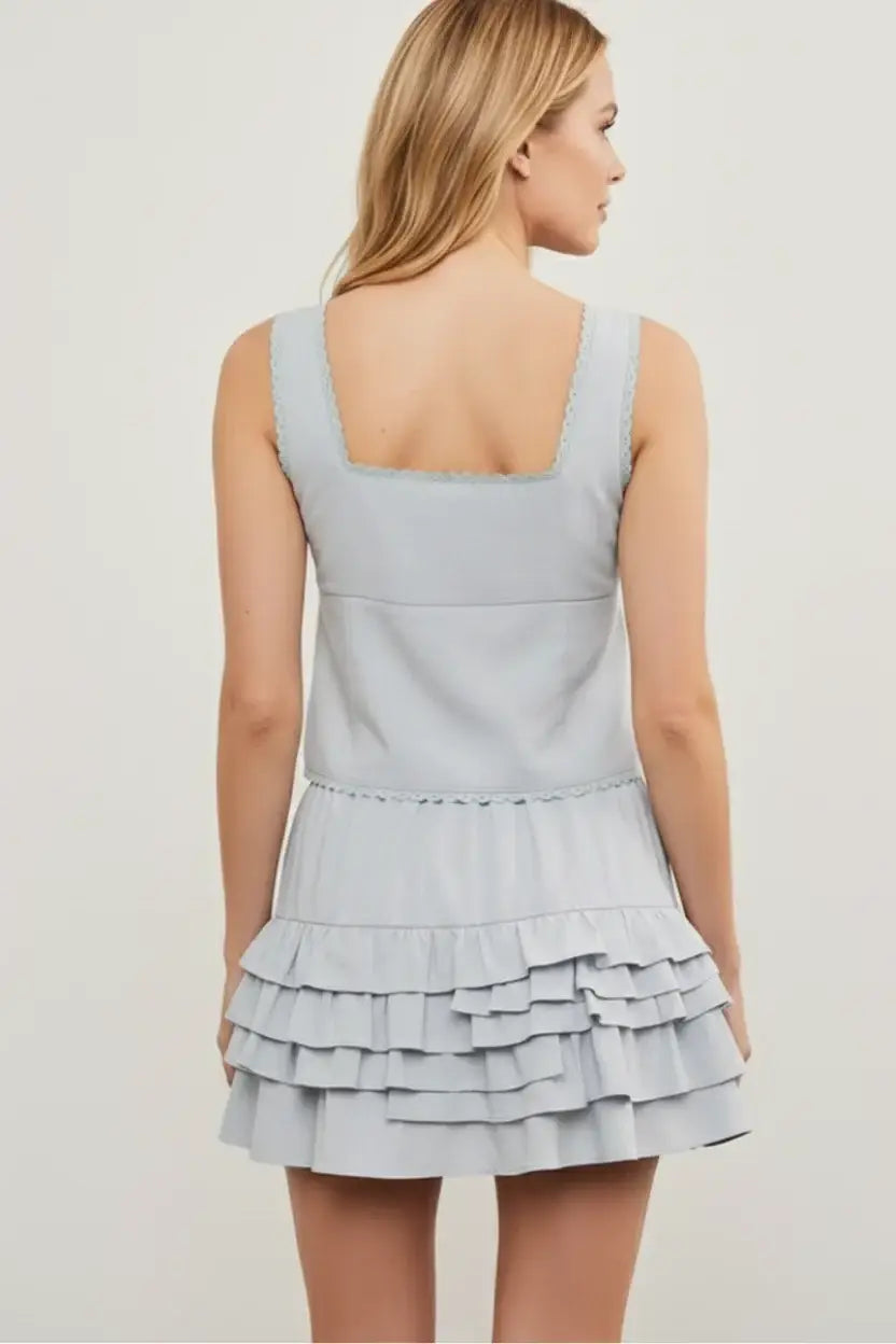 Light blue scallop trim sleeveless dress with ruffle skirt back view