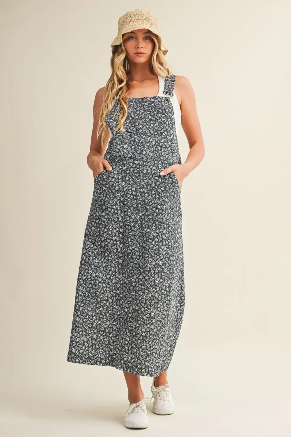 Navy blue ditsy floral print maxi dress with white adjustable straps