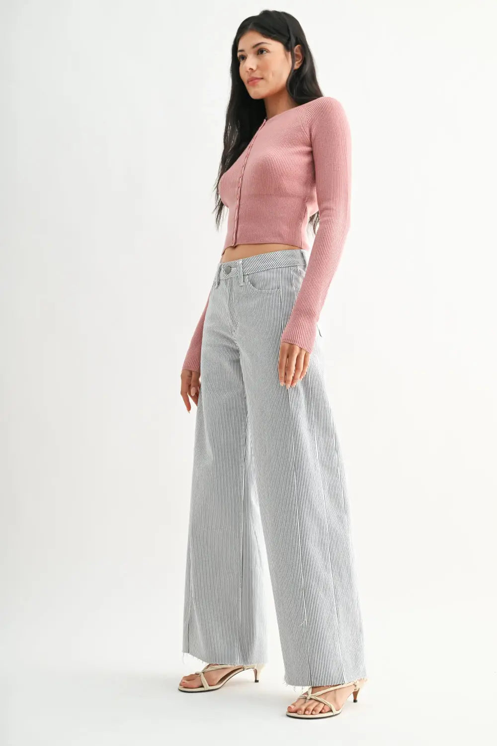 A pair of gray and white vertical stripe wide leg denim jeans crafted from denim fabric for a stylish look.