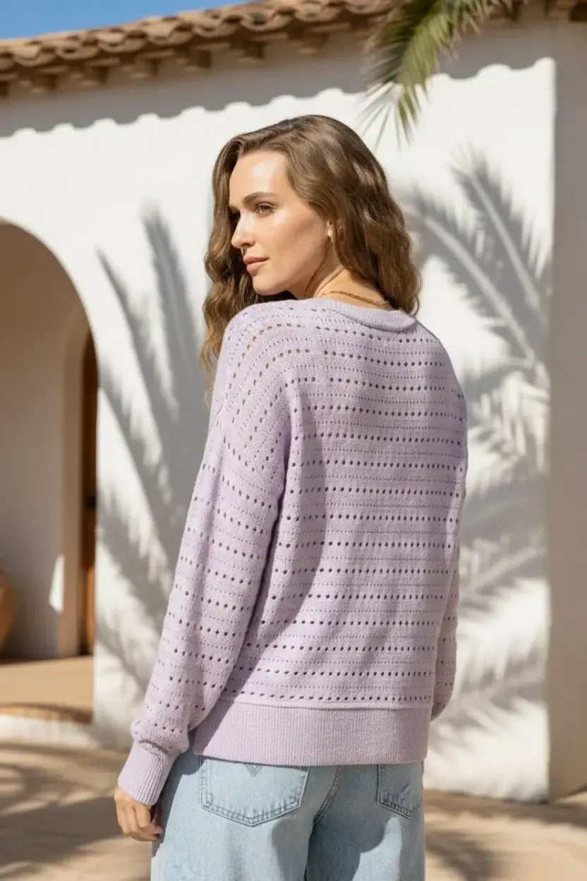 Soft lavender robin sweater with perforated pattern and ribbed cuffs