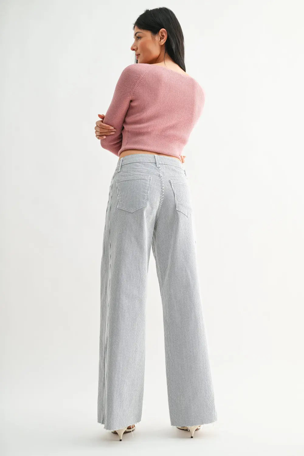 A pair of gray and white vertical stripe wide leg denim jeans crafted from denim fabric for a stylish look.