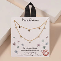 18k gold dipped layered necklace with brown beads and heart charms from Golden Earthy Spirit