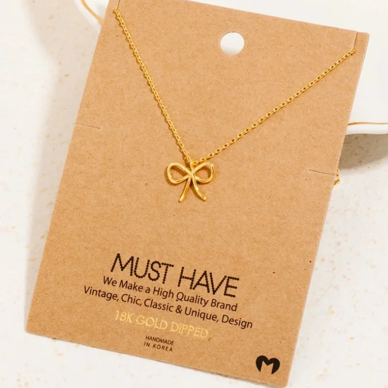 18k gold dipped wire ribbon bow pendant necklace with delicate chain