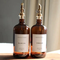 Amber glass dispenser set for olive oil and vinegar with brass spouts
