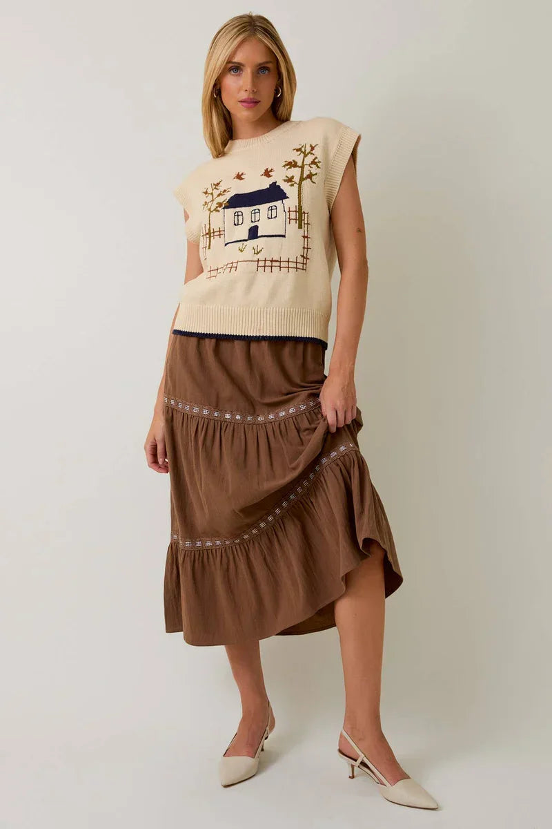 Crow neck sleeveless graphic sweater with beige brown layered ruffled skirt