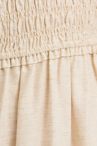Beige fabric with shirred elastic detail on ruffle sleeve midi dress for elegant style