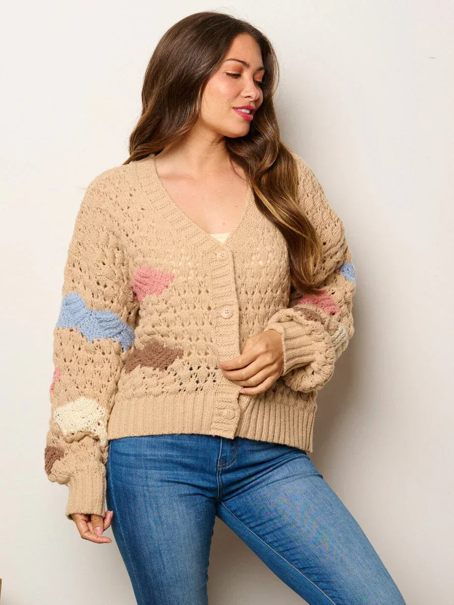 Beige knit cardigan with colorful striped sleeves from Shop Daisy women’s boho chic clothing