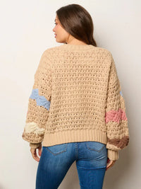 Beige knit sweater with colorful sleeve accents from Shop Daisy’s women’s boho chic clothing