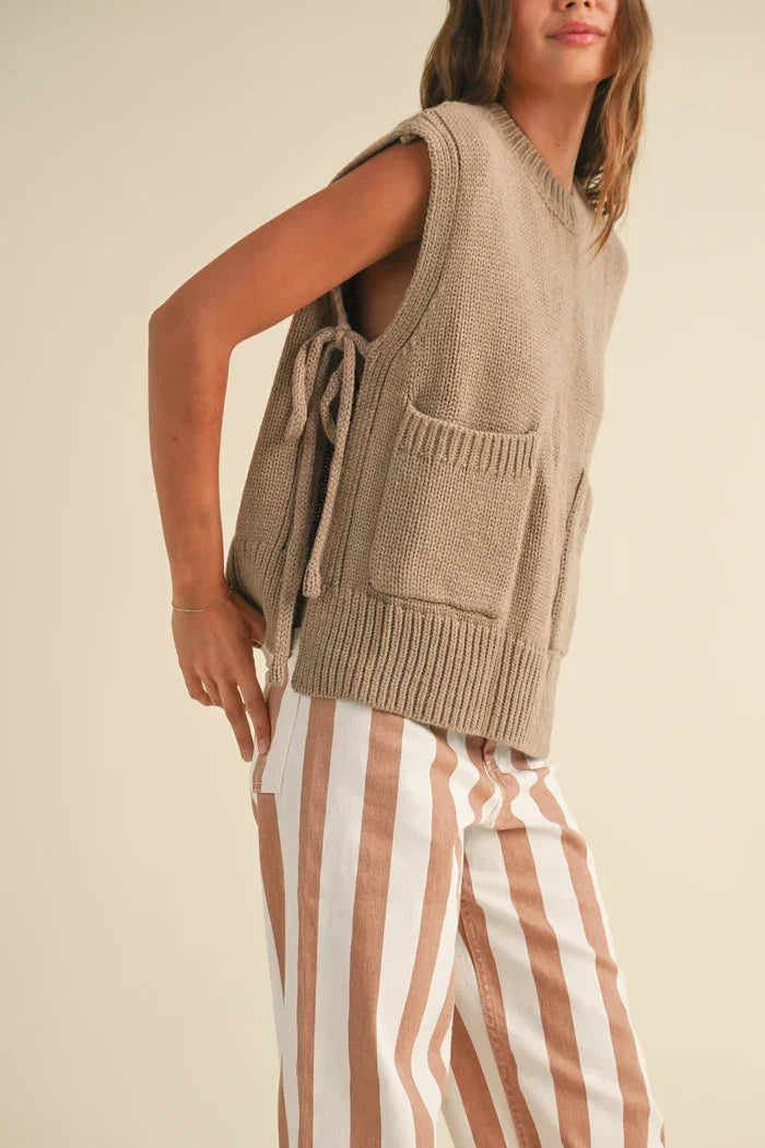 Beige knitted sleeveless sweater vest with pockets from Shop Daisy’s women’s boho chic clothing