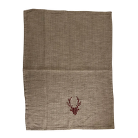 Beige linen tea towel featuring a small cotton embroidered deer head design