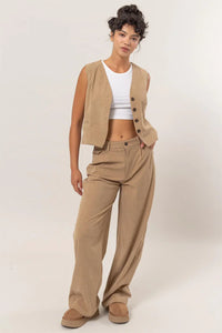 Beige linen vest and pants set with white crop top, perfect for women’s boho chic clothing