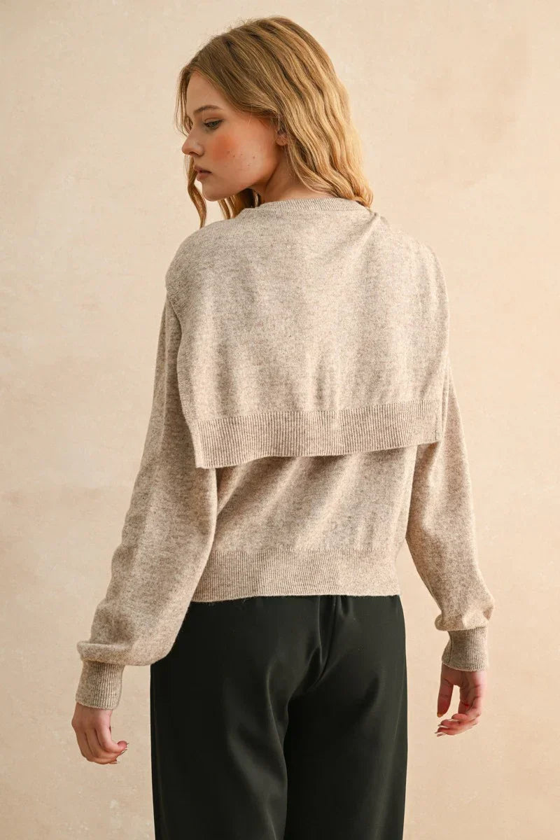 Beige marled knit round neck sweater with cape overlay and ribbed cuffs