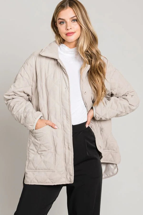 Beige collared button front quilted jacket with high collar and front pockets