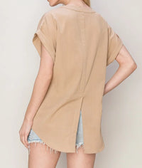 Beige flowy WOVEN V-NECK SPLIT BACK TOP for a free spirit over denim shorts